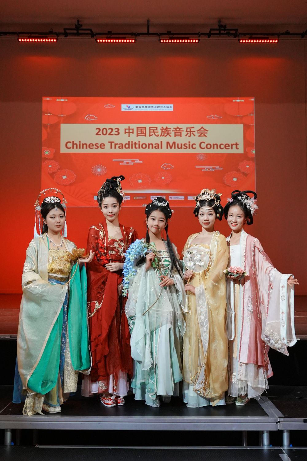 Group photo of performers in Hanfu at a Chinese Traditional Music Concert, captured by an Auckland event photographer.