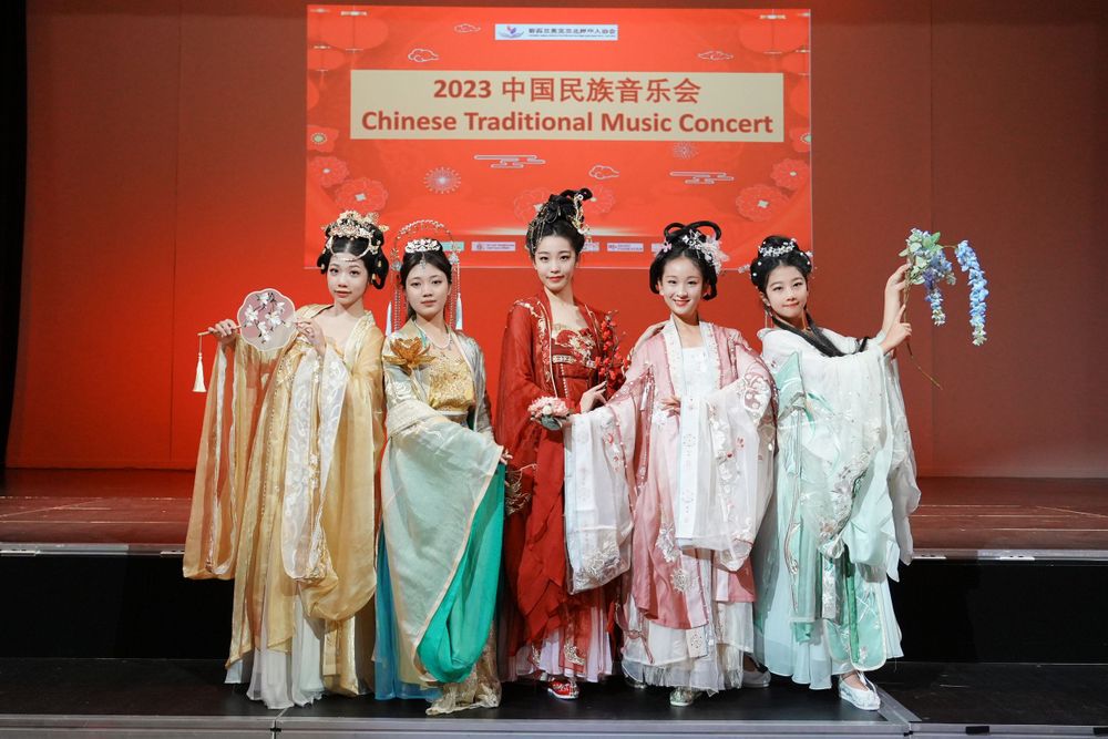 Group photo of performers in Hanfu at a Chinese Traditional Music Concert, captured by an Auckland event photographer.