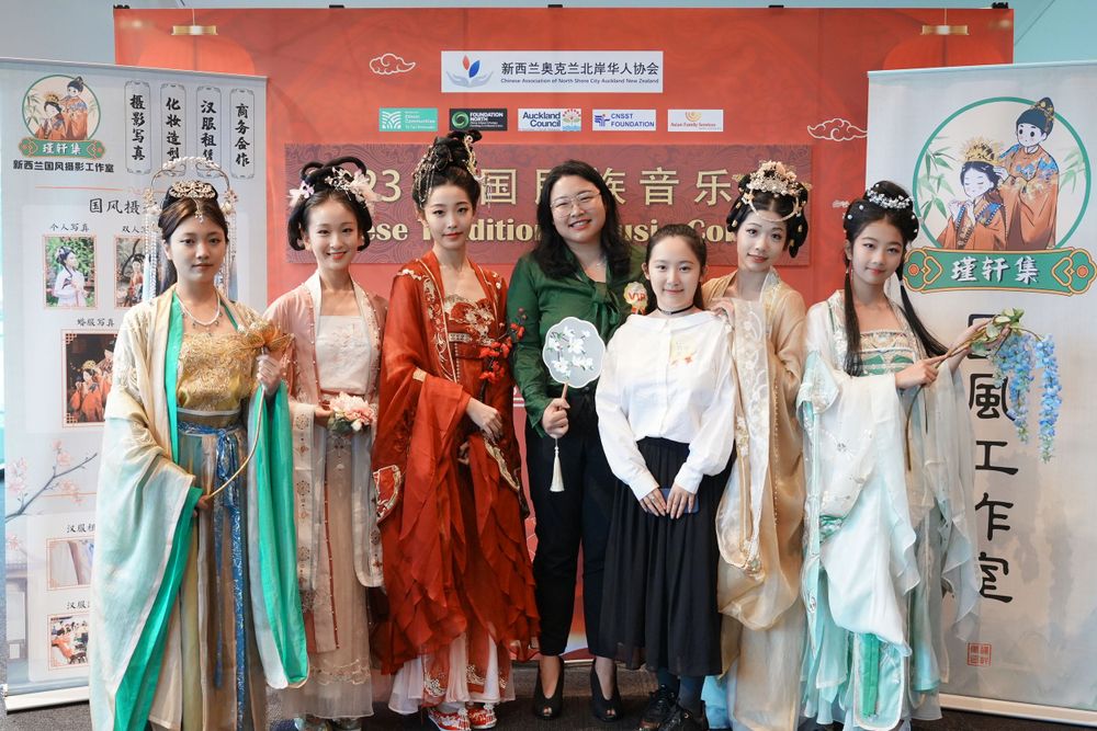 Group photo of performers in Hanfu at a Chinese Traditional Music Concert, captured by an Auckland event photographer.