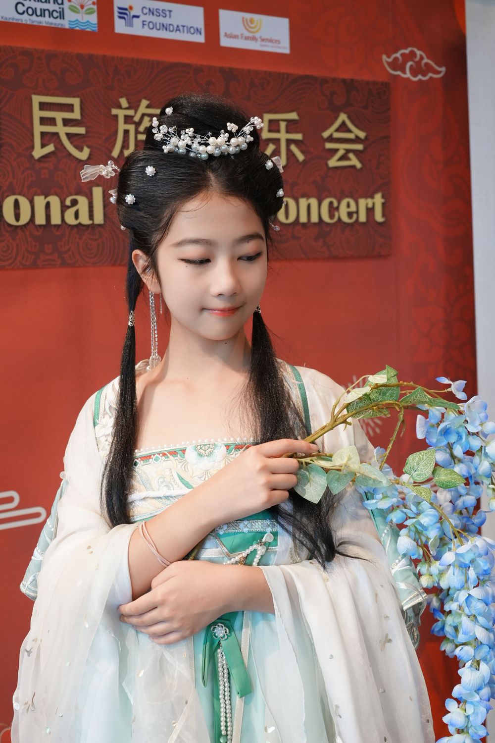 Group photo of performers in Hanfu at a Chinese Traditional Music Concert, captured by an Auckland event photographer.