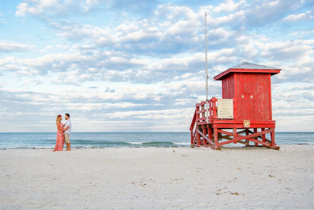 wide photo of couple on beach in New Port Richey