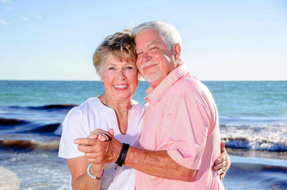 photo of older couple dancing on beach in New Port Richey