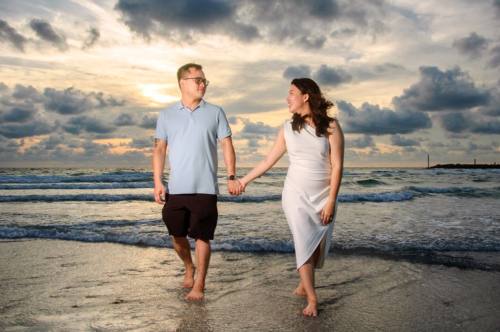photo couple walking from water in New Port Richey