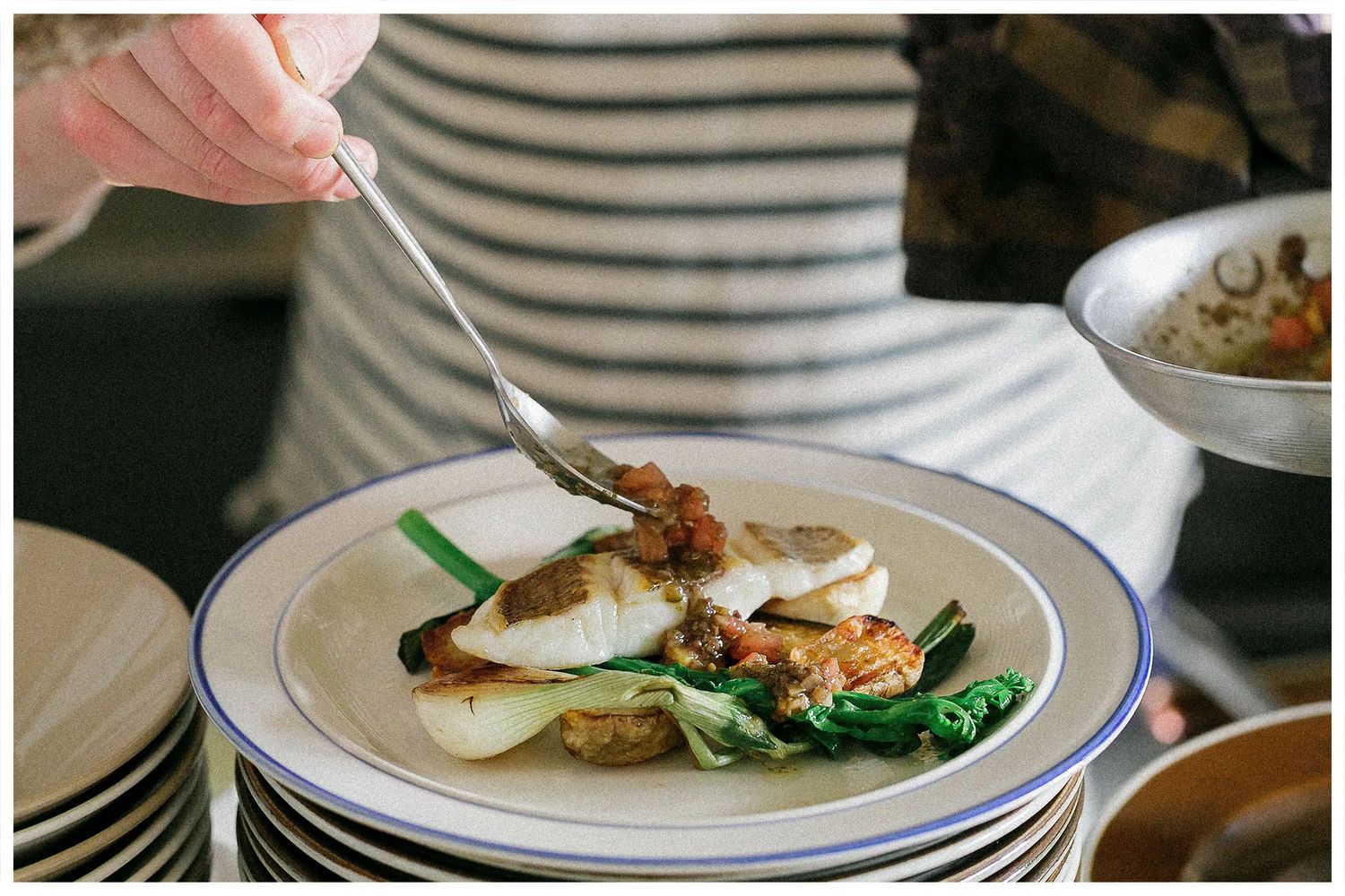 Six close-up shots of plated dishes being served at an upscale restaurant with elegant presentation.