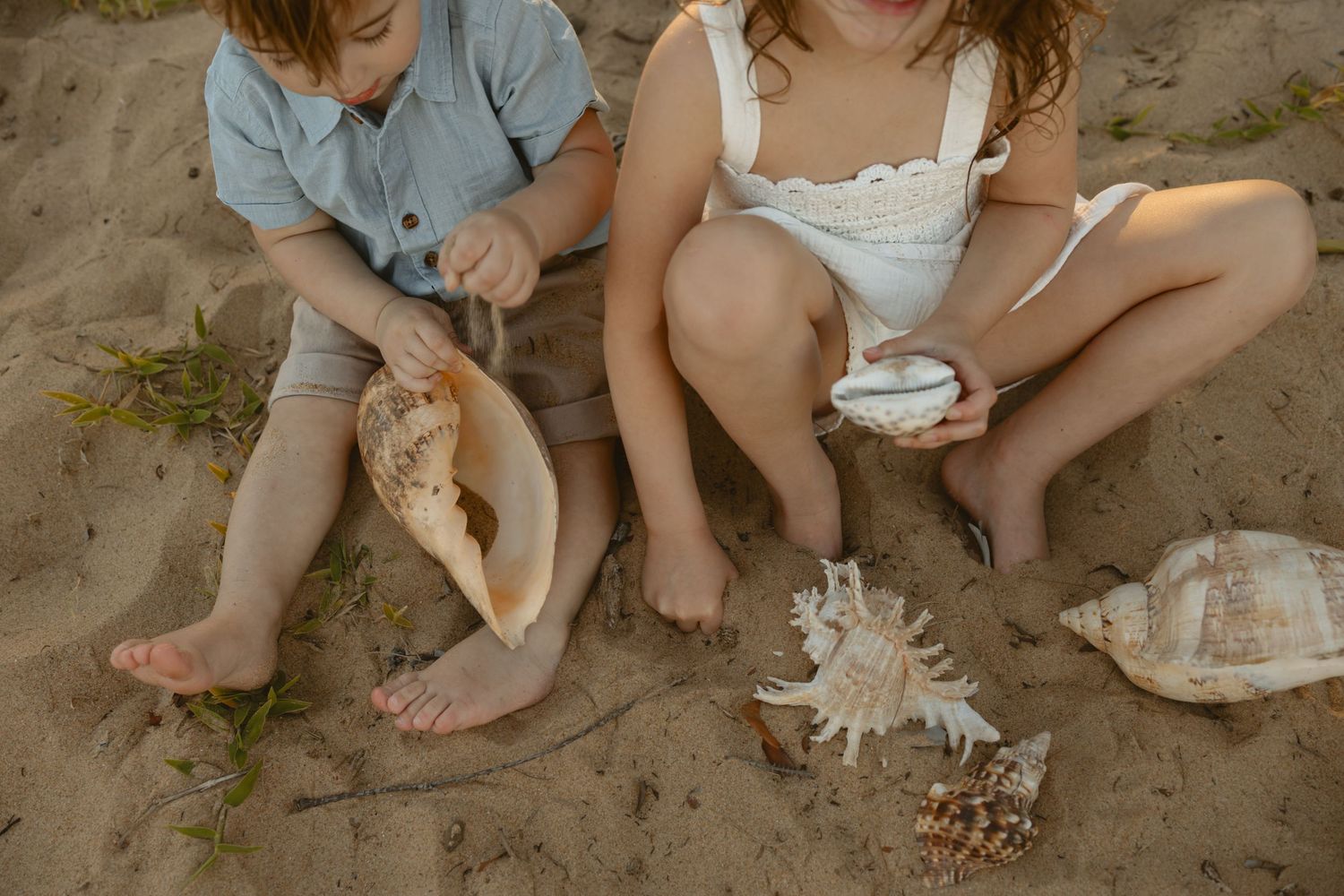 Four close-up photos showing bare feet playing in sand at the beach creating a relaxing summer scene.