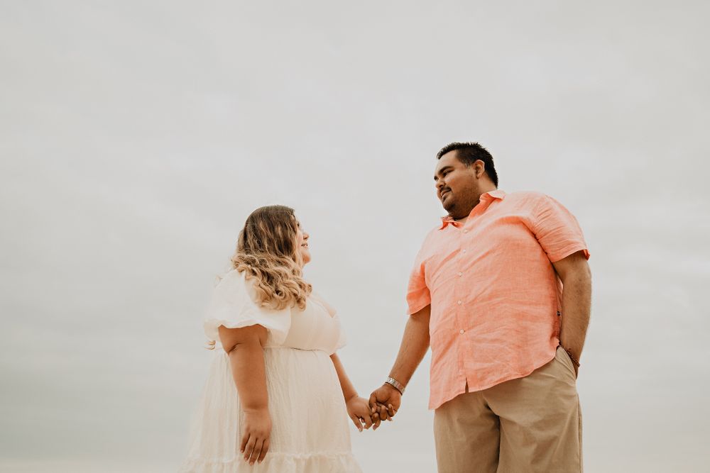 Looking at each other, cloudy sky background