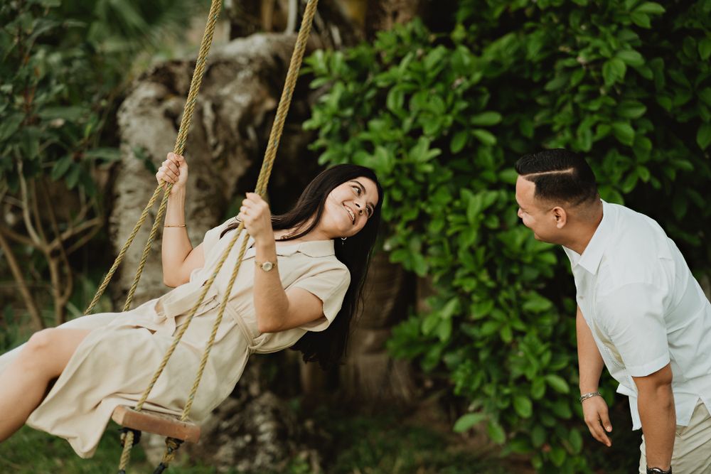 Groom swinging his bride, a playful and joyful moment