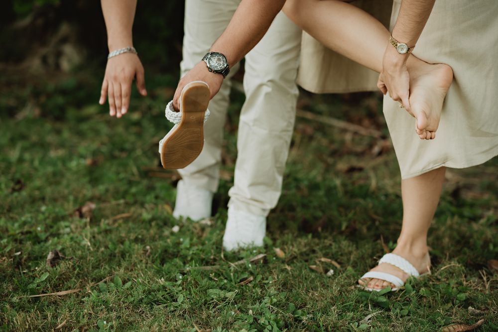 Playfully shaking off their feet ants, a fun destination wedding detail