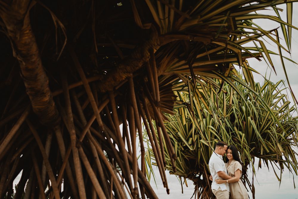 Artistic embrace under the sky, captured beautifully by their wedding photographer