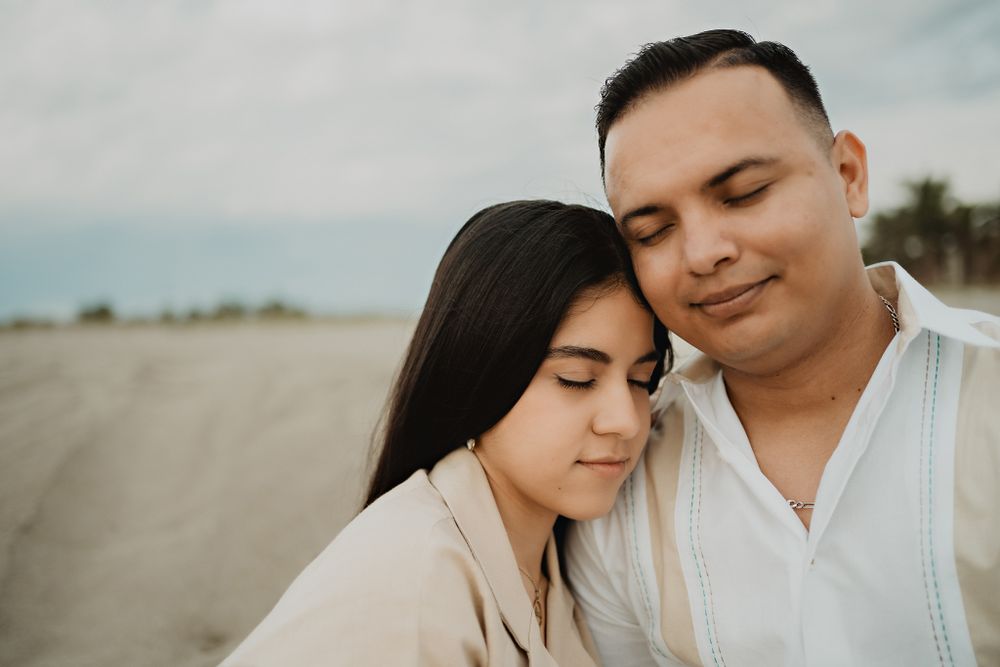 Resting against a surface, a moment of calm before their big day, framed by a skilled destination wedding photographer