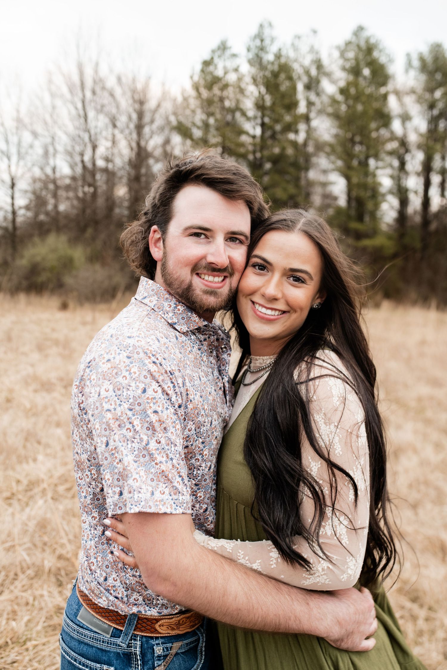 Couples photo session with western inspiration, featuring rustic styles and scenic outdoor backdrops for a unique and romantic vibe.