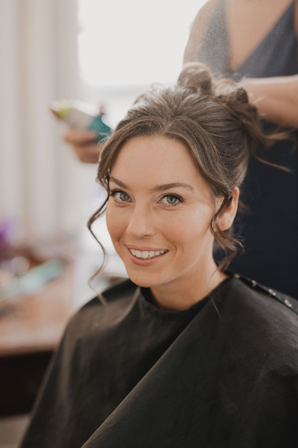 Getting ready sequence showing hair styling preparations in natural light.