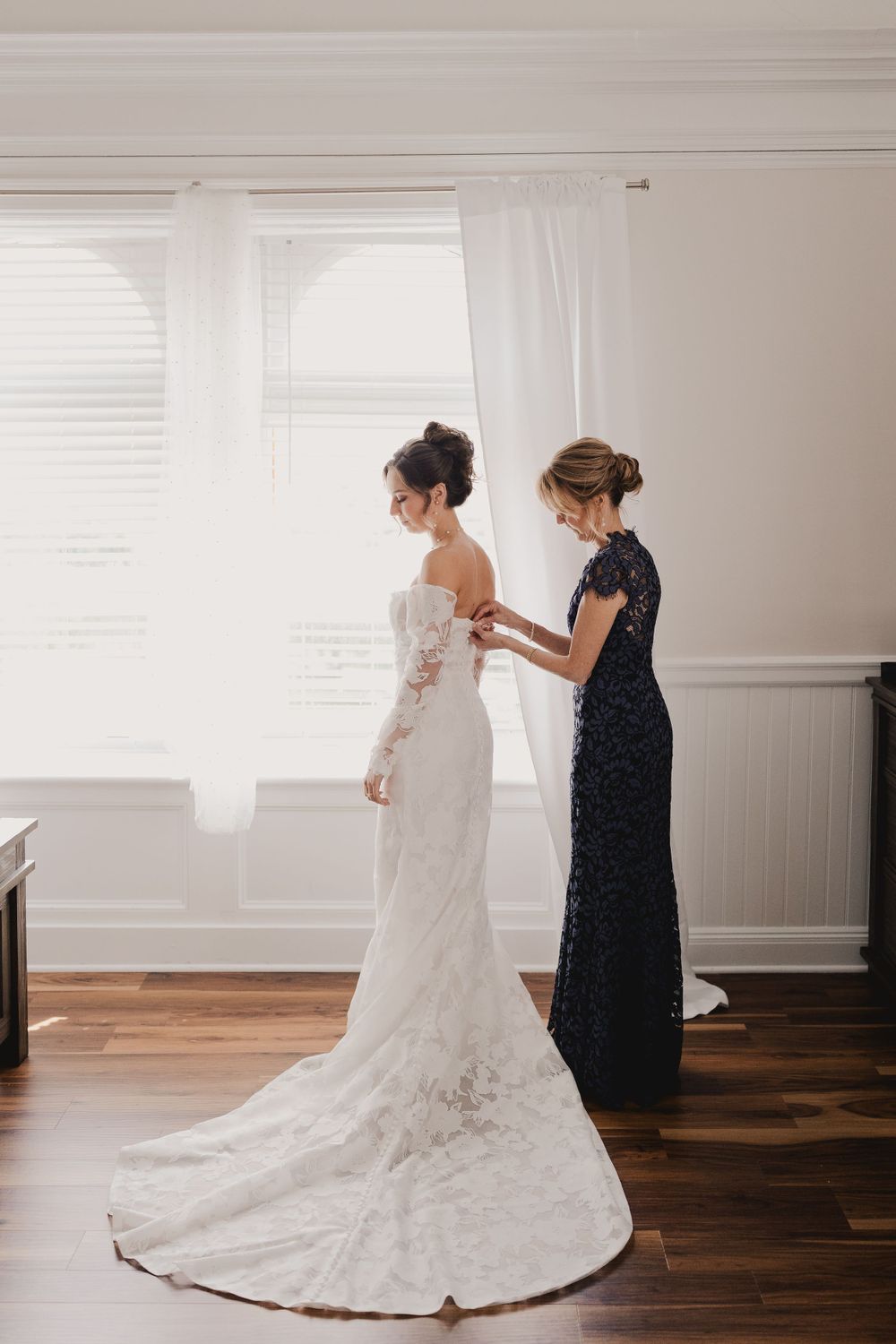Sequence showing the careful preparation and arranging of a lace wedding dress.