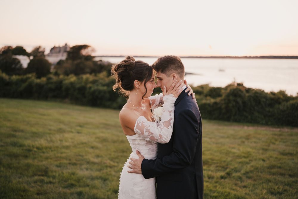 Intimate embrace between couple during sunset waterfront wedding photoshoot.