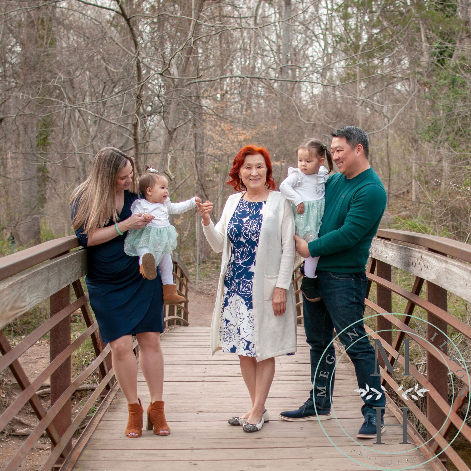 Photo of a family on a wooden bridge walkway at Ellanor C Lawrence Park in Chantilly, VA.