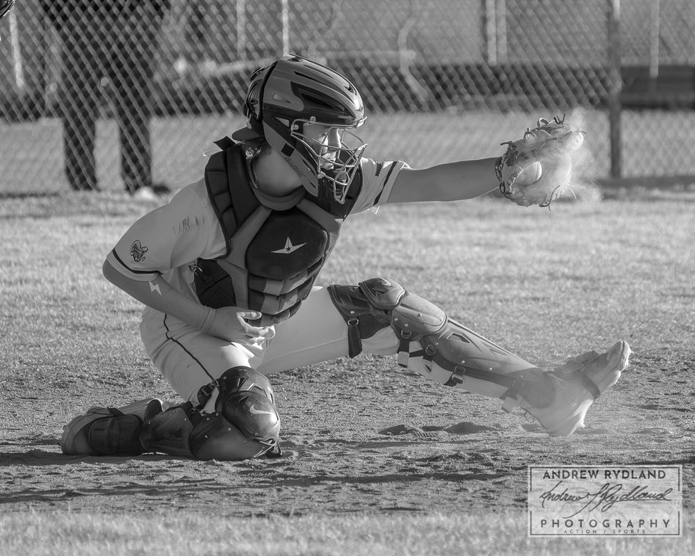 Black and white sequence of a baseball player sliding into base during a game.