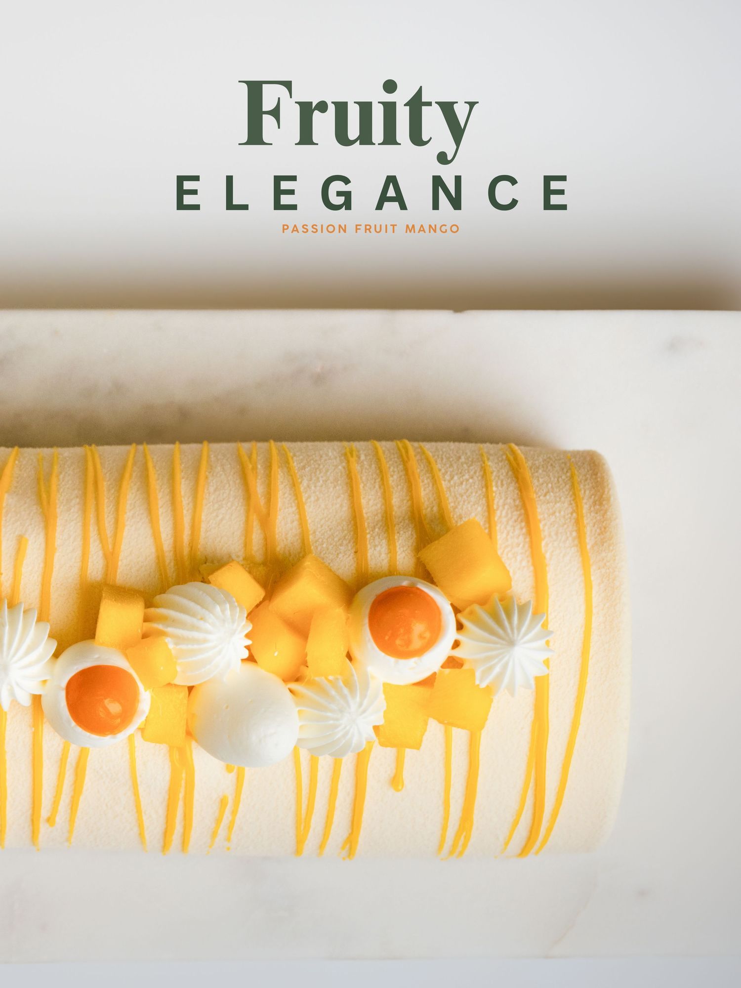 A passionfruit mango roll cake topped with mango cubes, cream rosettes, and yellow drizzle on marble.