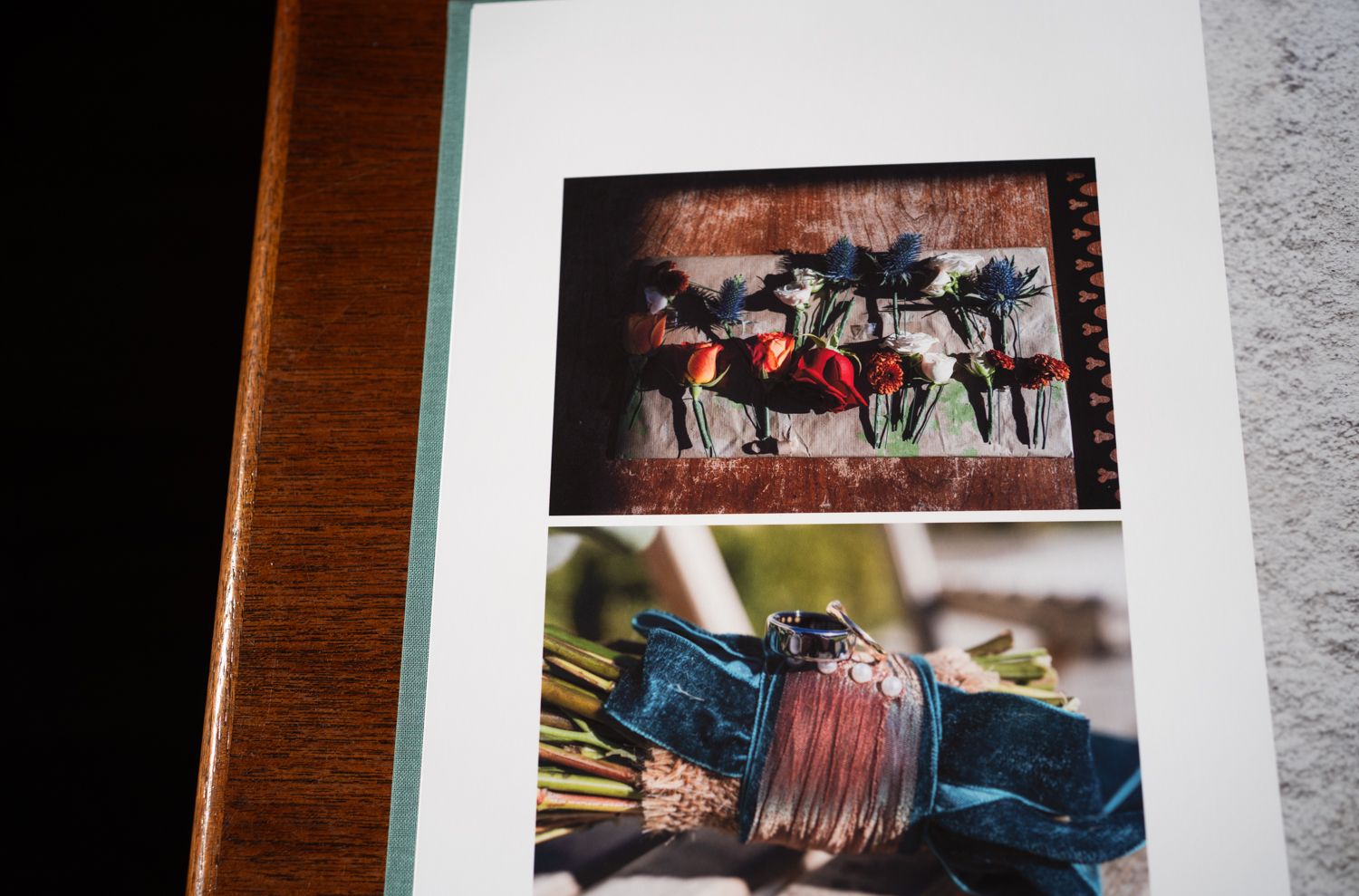 A photography album page shows two photos - a group lifting drinks in celebration and a close-up of a glass bottle.
