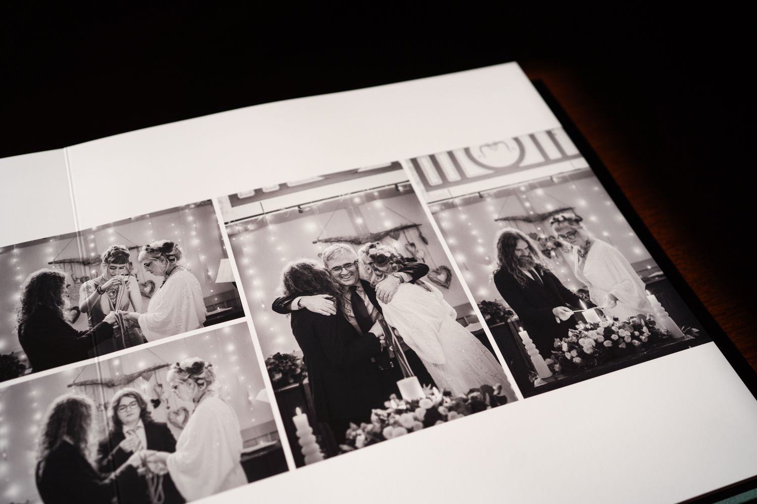Black and white wedding photography album showing multiple candid moments from a reception celebration.