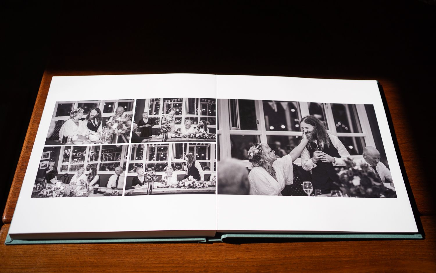 Black and white wedding album spread showing celebratory reception moments.