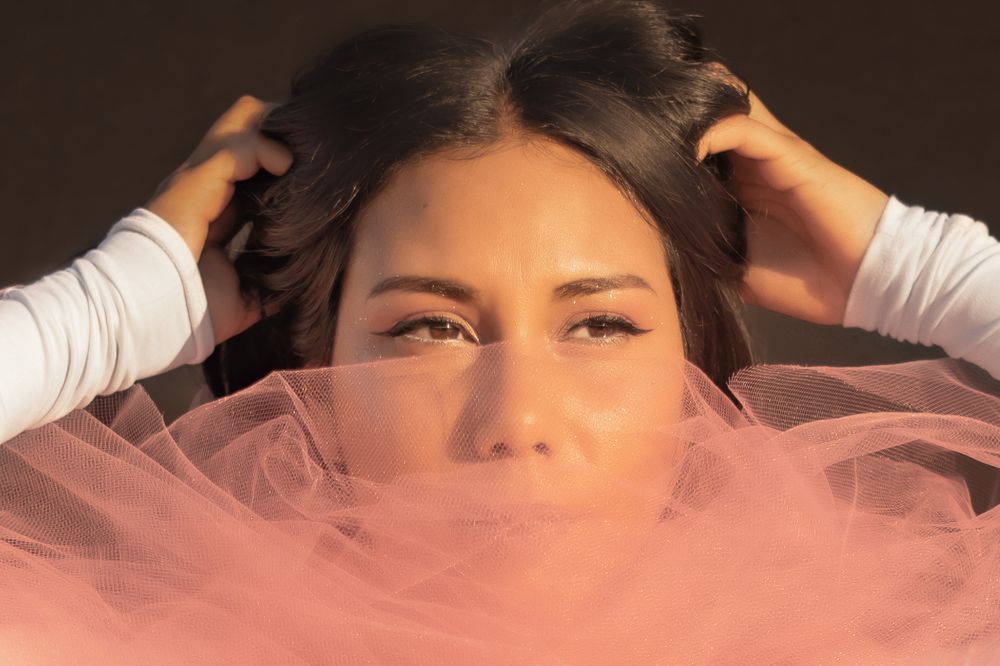 A creative golden hour photoshoot taken with tulle in Spokane Washington by Jessica Rae Photography.