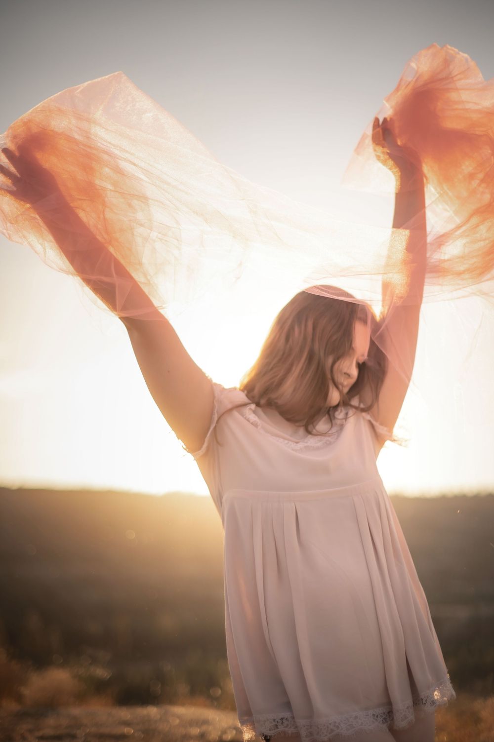 A creative golden hour photoshoot taken with tulle in Spokane Washington by Jessica Rae Photography.