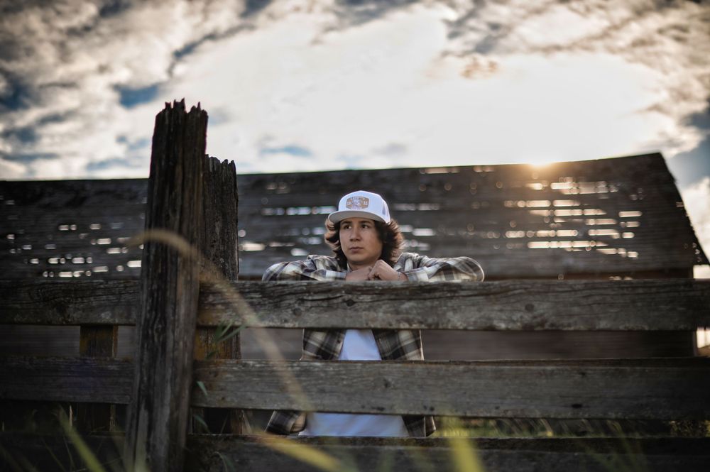 A high school senior posing for a portrait in Spokane Washington. By Jessica Rae Photography.