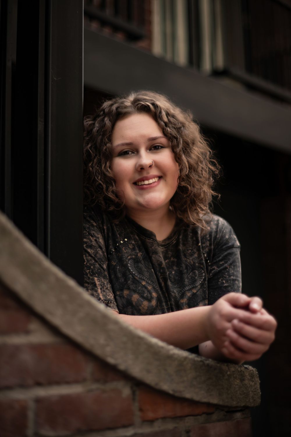 A high school senior during a photo shoot in downtown spokane for a senior portrait. By Jessica Rae Photography.