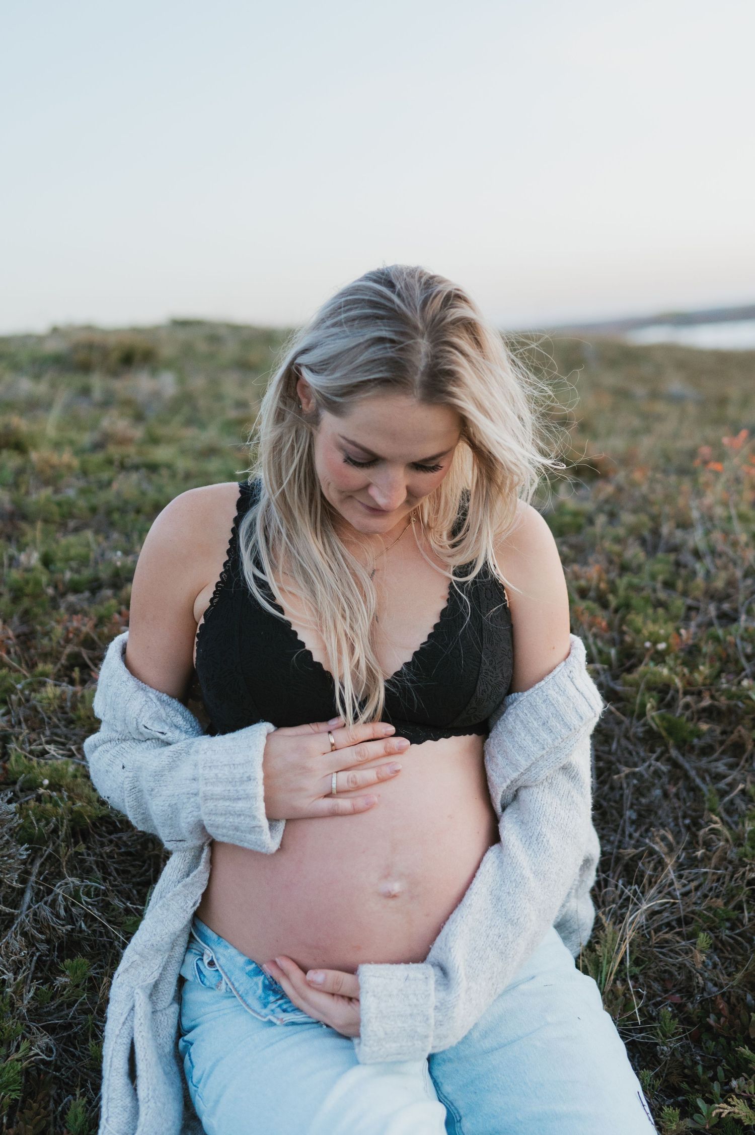 An intimate maternity portrait showing gentle connection with growing life.