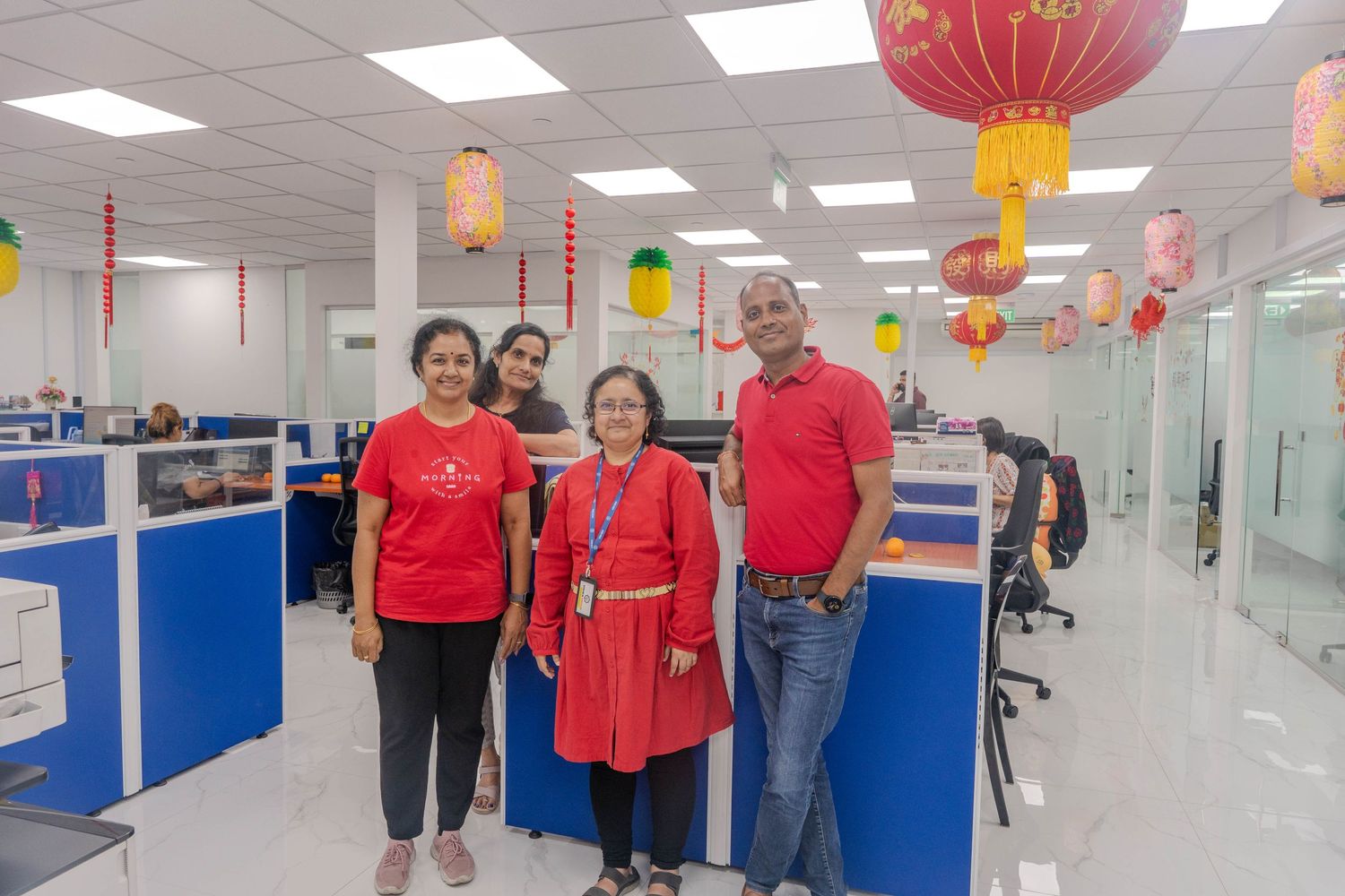 Office celebration with Chinese lanterns and decorative elements in a modern workspace.