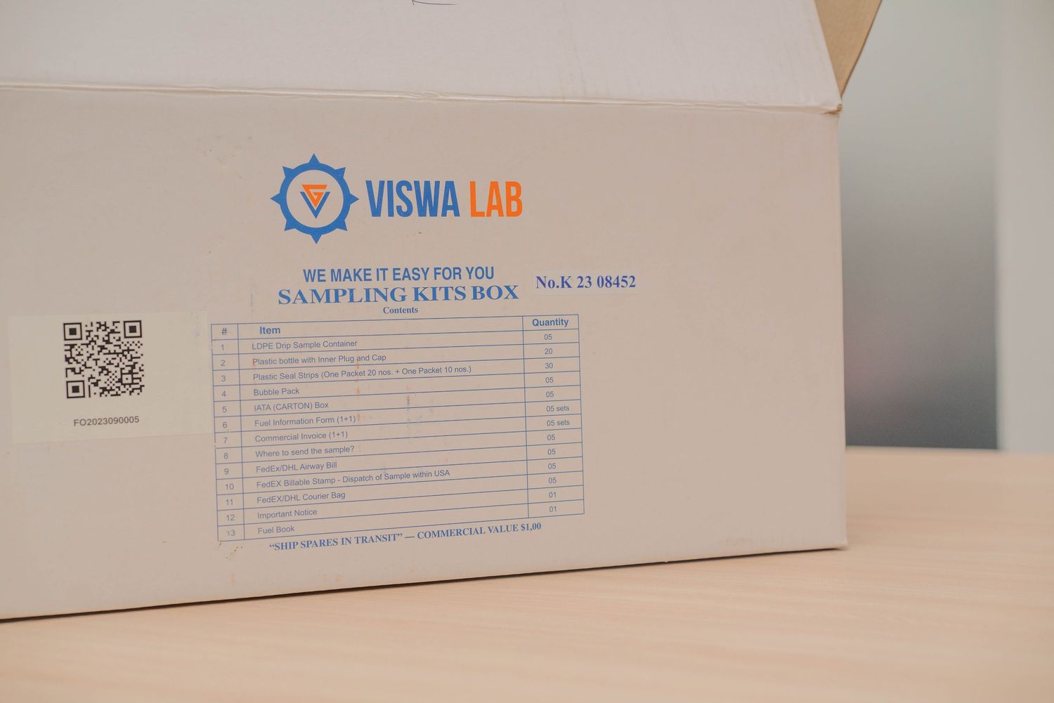 White cardboard box with Viswa Lab branding and QR code visible.