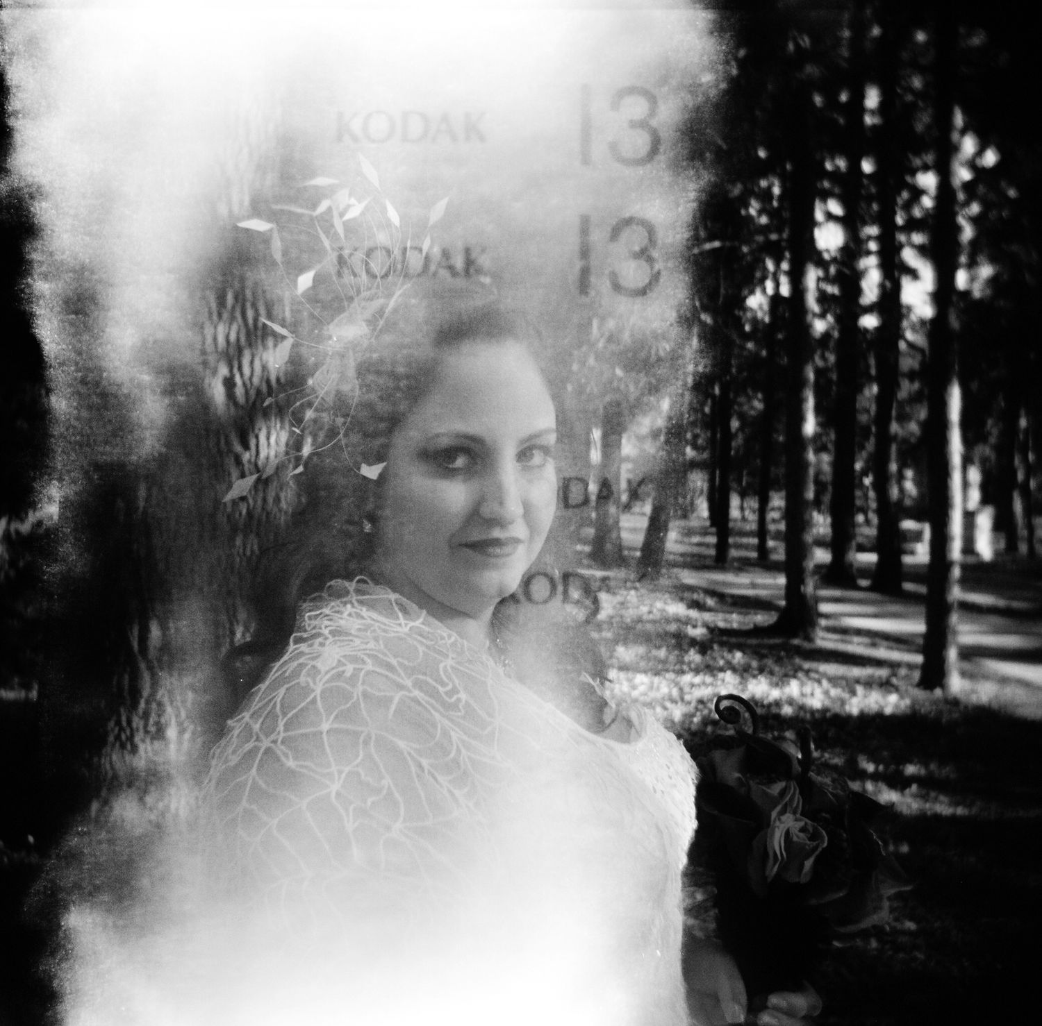 Wedding bride portrait with hola and black and white film.