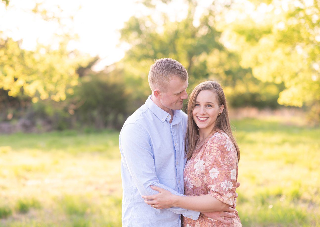 Family of 4 spring portrait session in light grassy field by Bartlesville photographer Kristi Bray