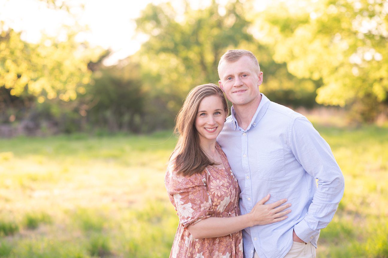 Family of 4 spring portrait session in light grassy field by Bartlesville photographer Kristi Bray