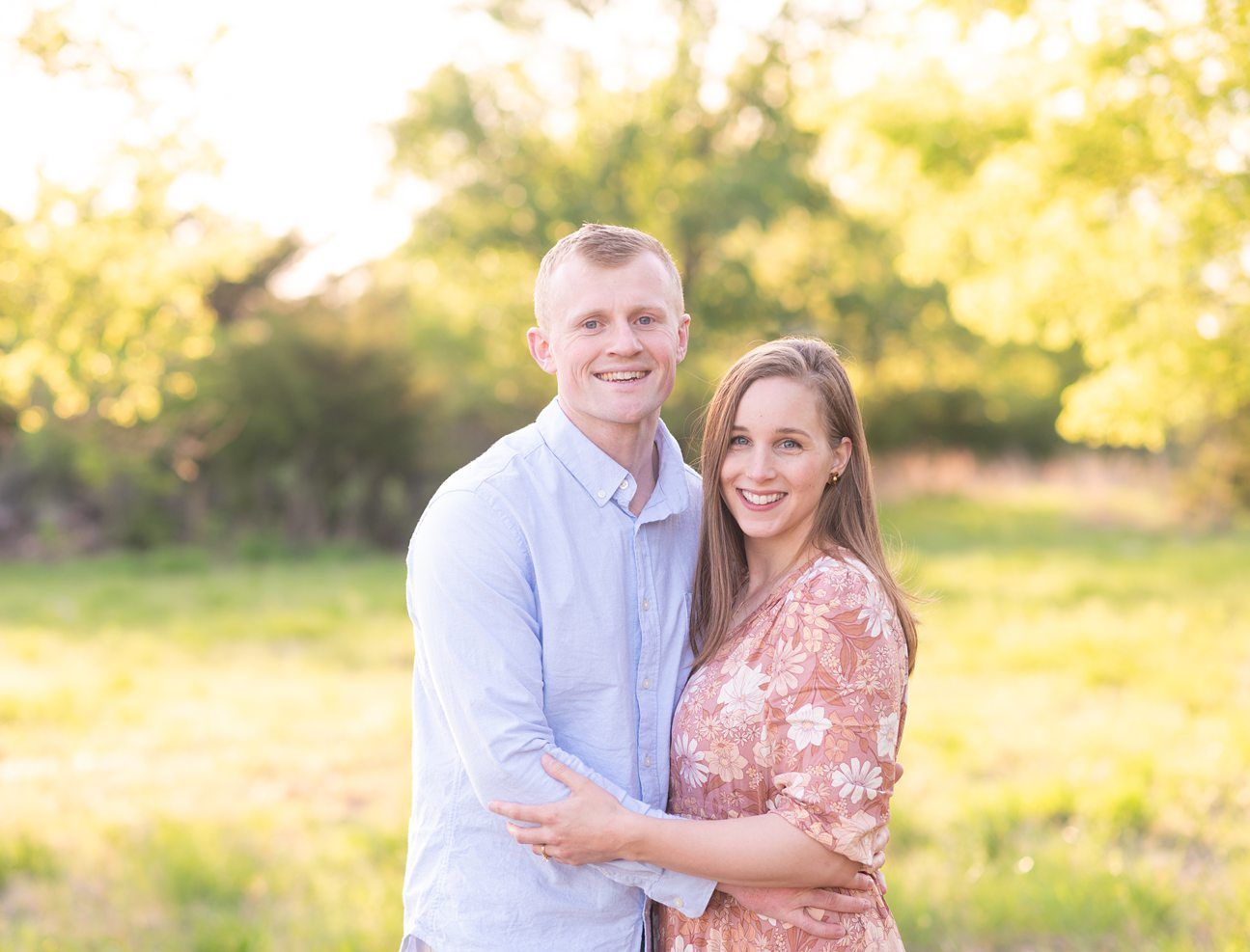 Family of 4 spring portrait session in light grassy field by Bartlesville photographer Kristi Bray