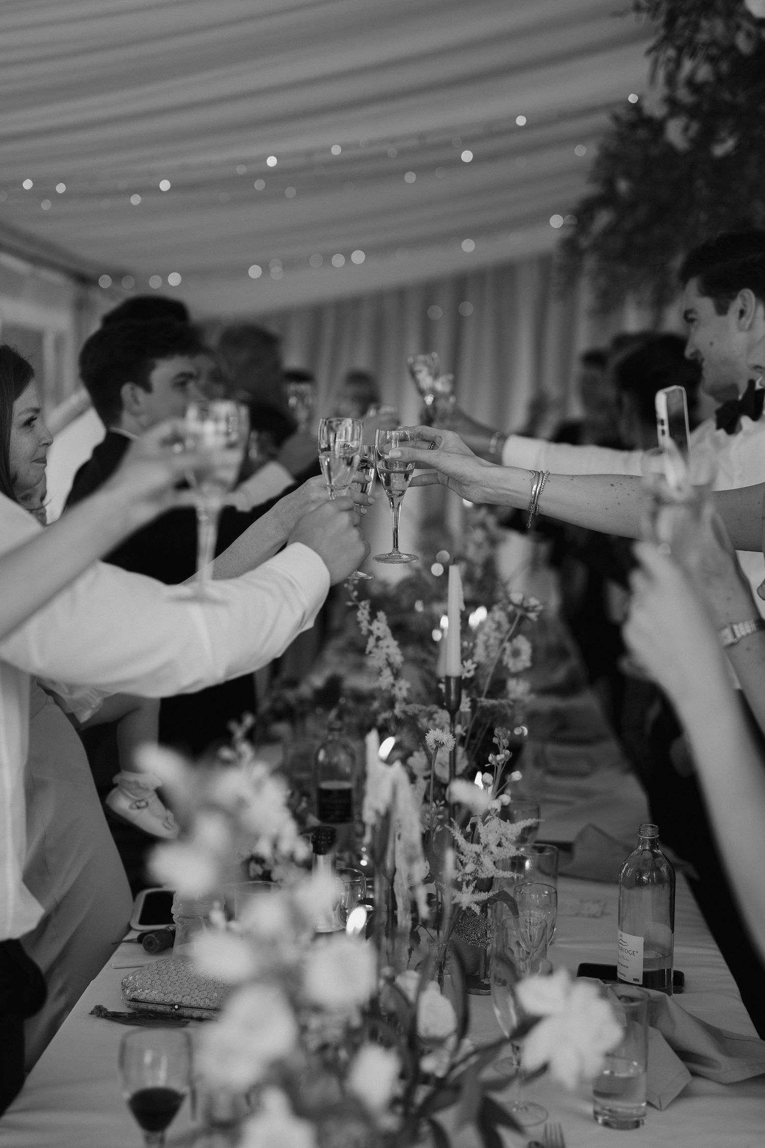 glasses of champagne being toasted at hamswell house wedding in bath