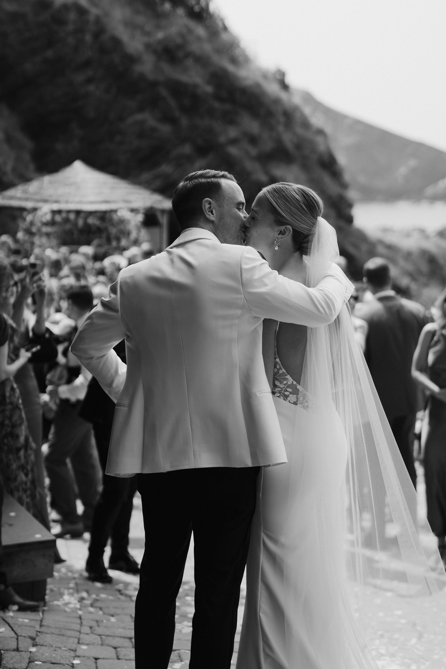 Bride and Groom kissing at Tunnels Beach wedding venue in north devon