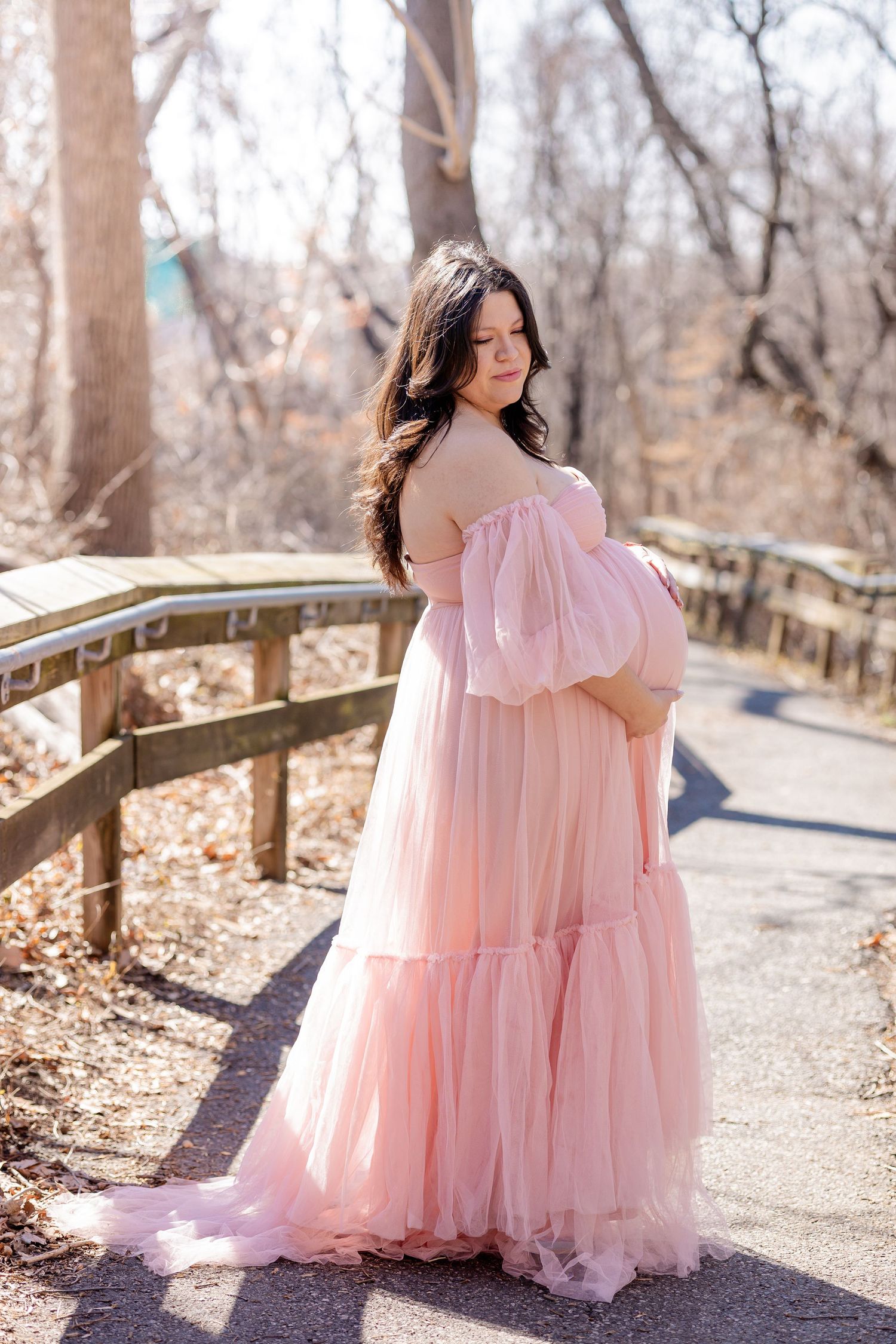 A portrait against a golden backdrop with decorative tassels.
