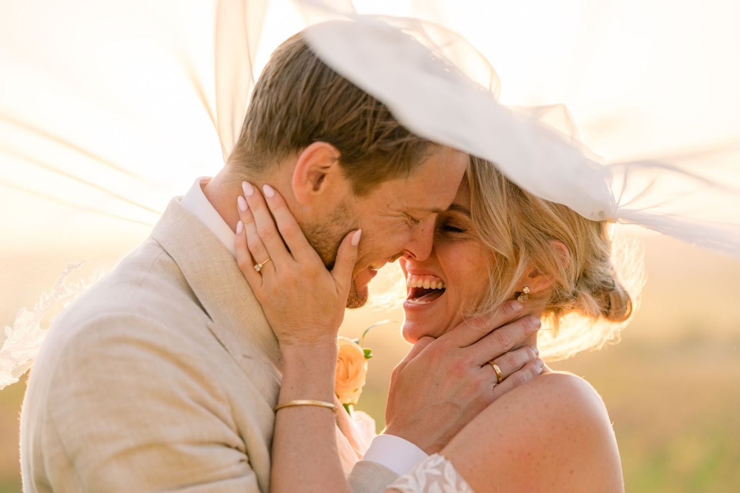 Romantic sunset wedding portraits showing intimate moments between newlyweds.