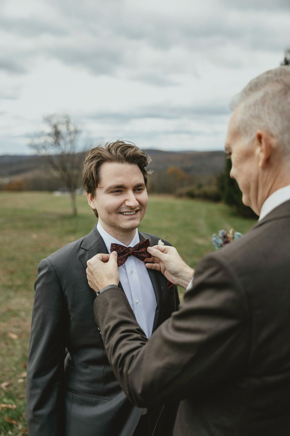 A series of candid moments showing someone helping adjust a bowtie before a formal event in an outdoor setting.