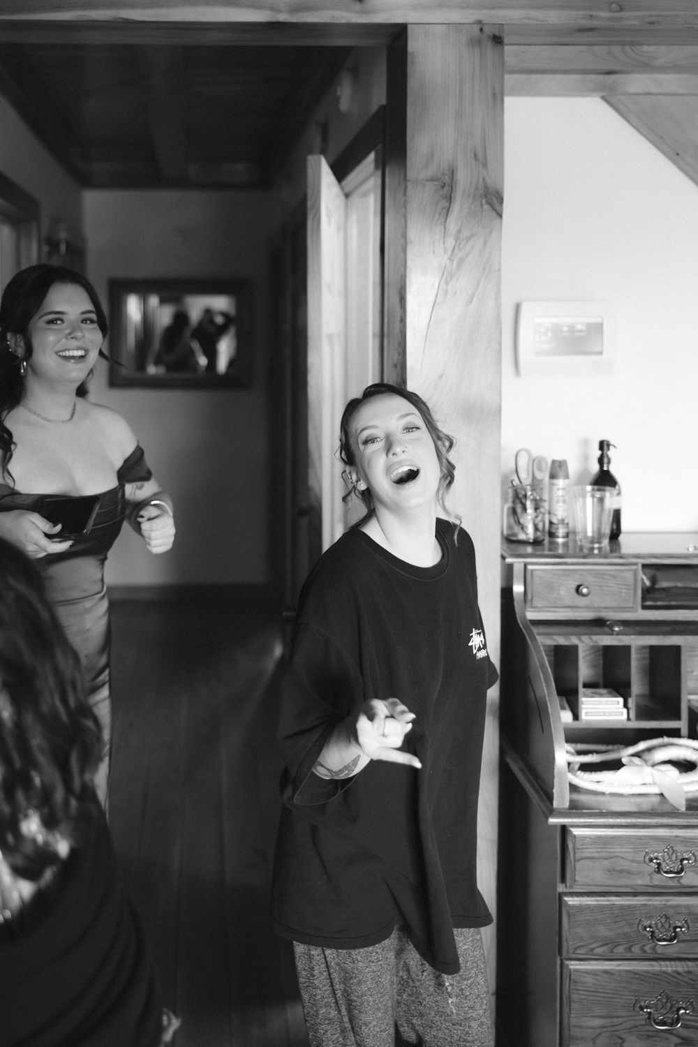 A series of monochrome images capturing intimate morning moments in a wooden cabin setting.