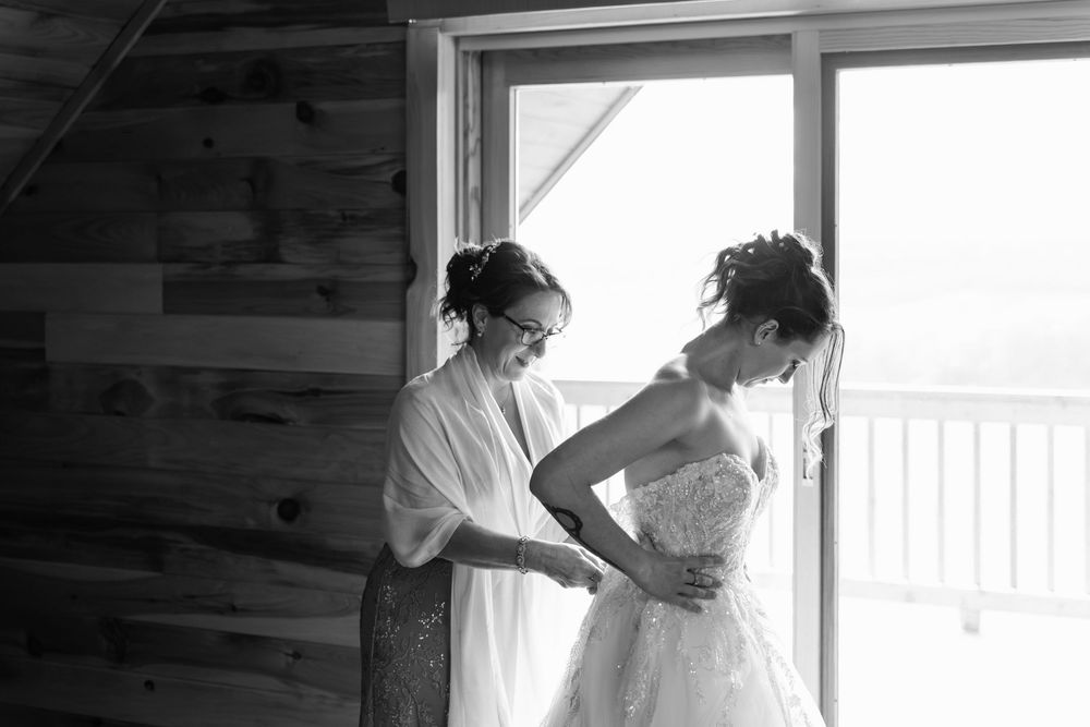 A sequence of black and white photographs showing intimate moments during a wedding preparation.