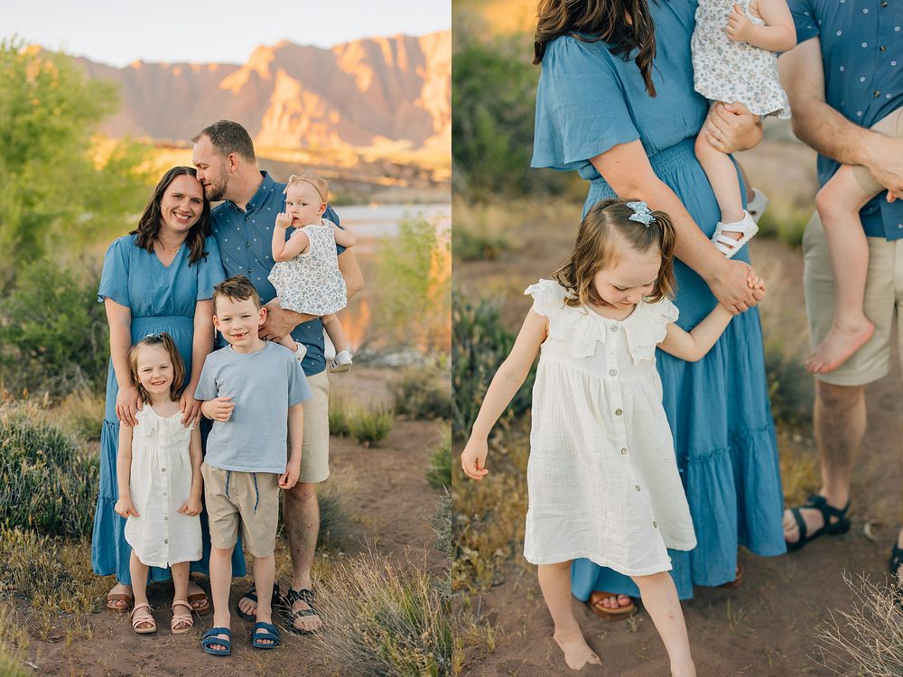 Family of five in coordinating blue and white outfits posing outdoors with red rock mountains backdrop.
