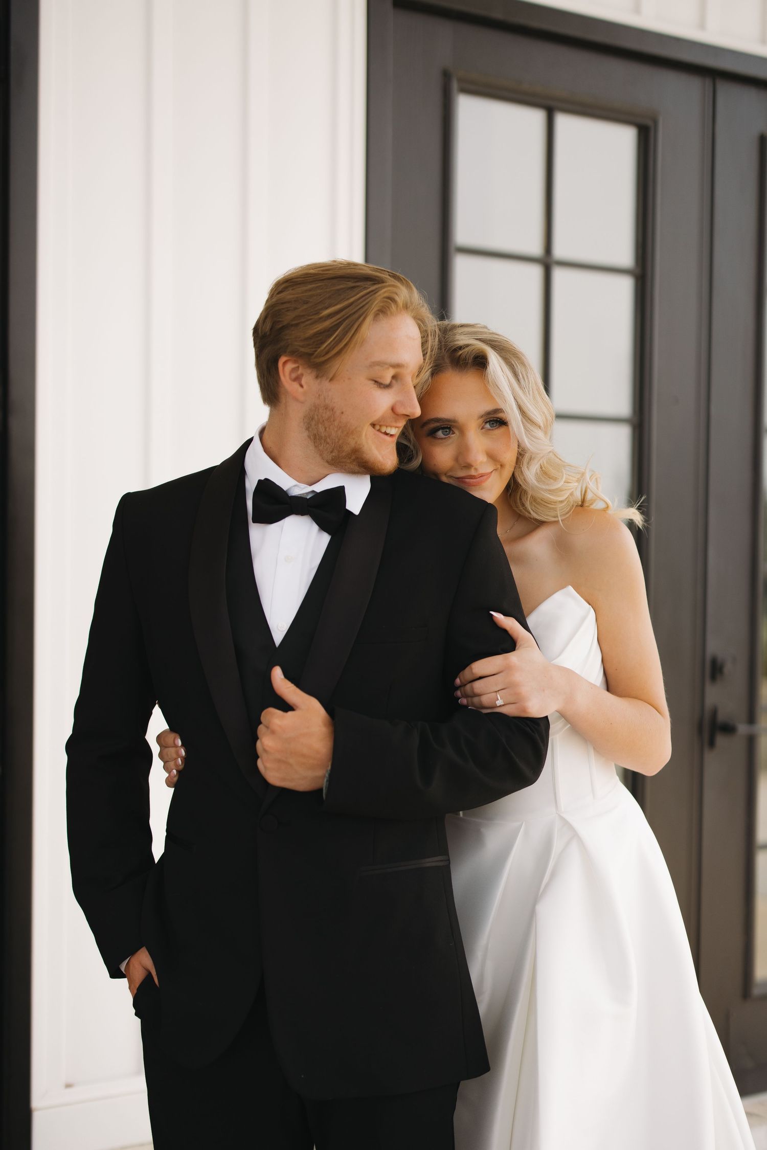 Close-up portrait of a bride and groom embracing at Fair Haven at the Vineyards wedding venue in Arkansas.