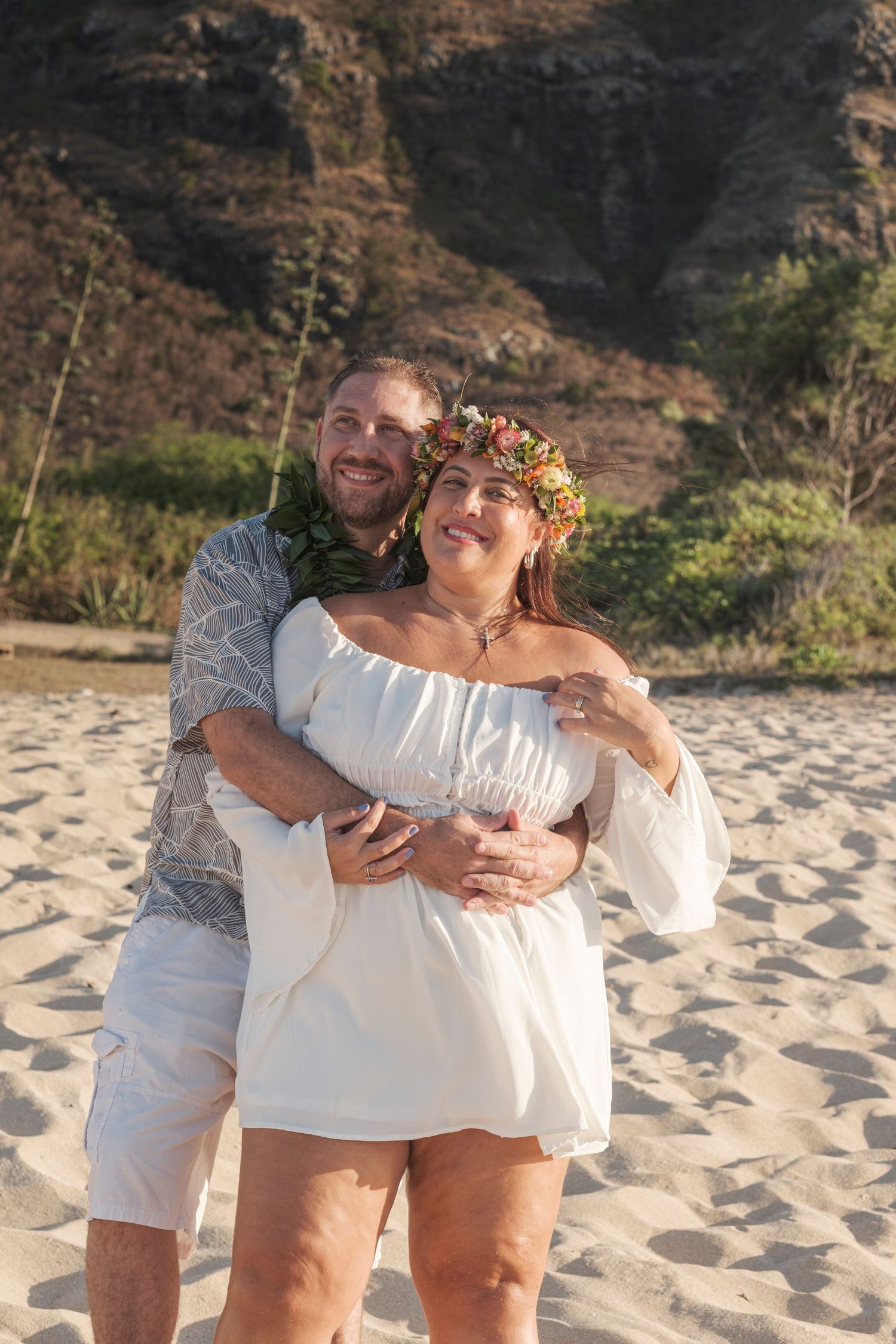 Couple sharing an intimate moment during a North Shore Oahu couples photography session at golden hour.