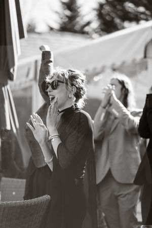 Black and white photo series showing a person in sunglasses smoking outdoors.
