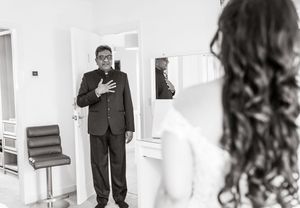 A series of black and white wedding photographs displayed in a horizontal row showing moments from the ceremony.