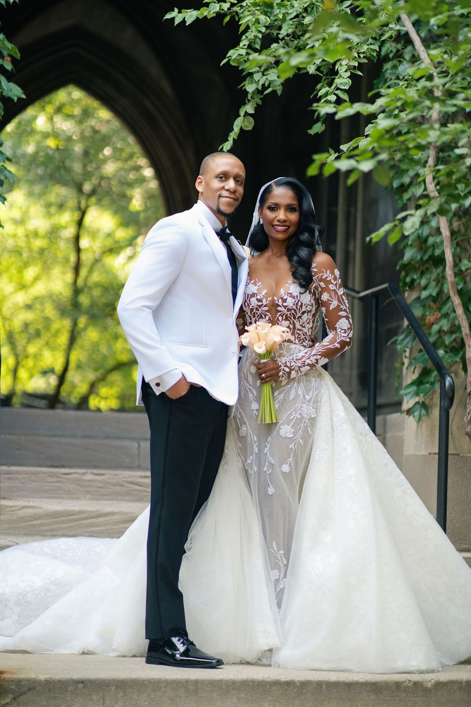 A romantic wedding photo series showing a couple posing together under a garden archway with lush greenery.