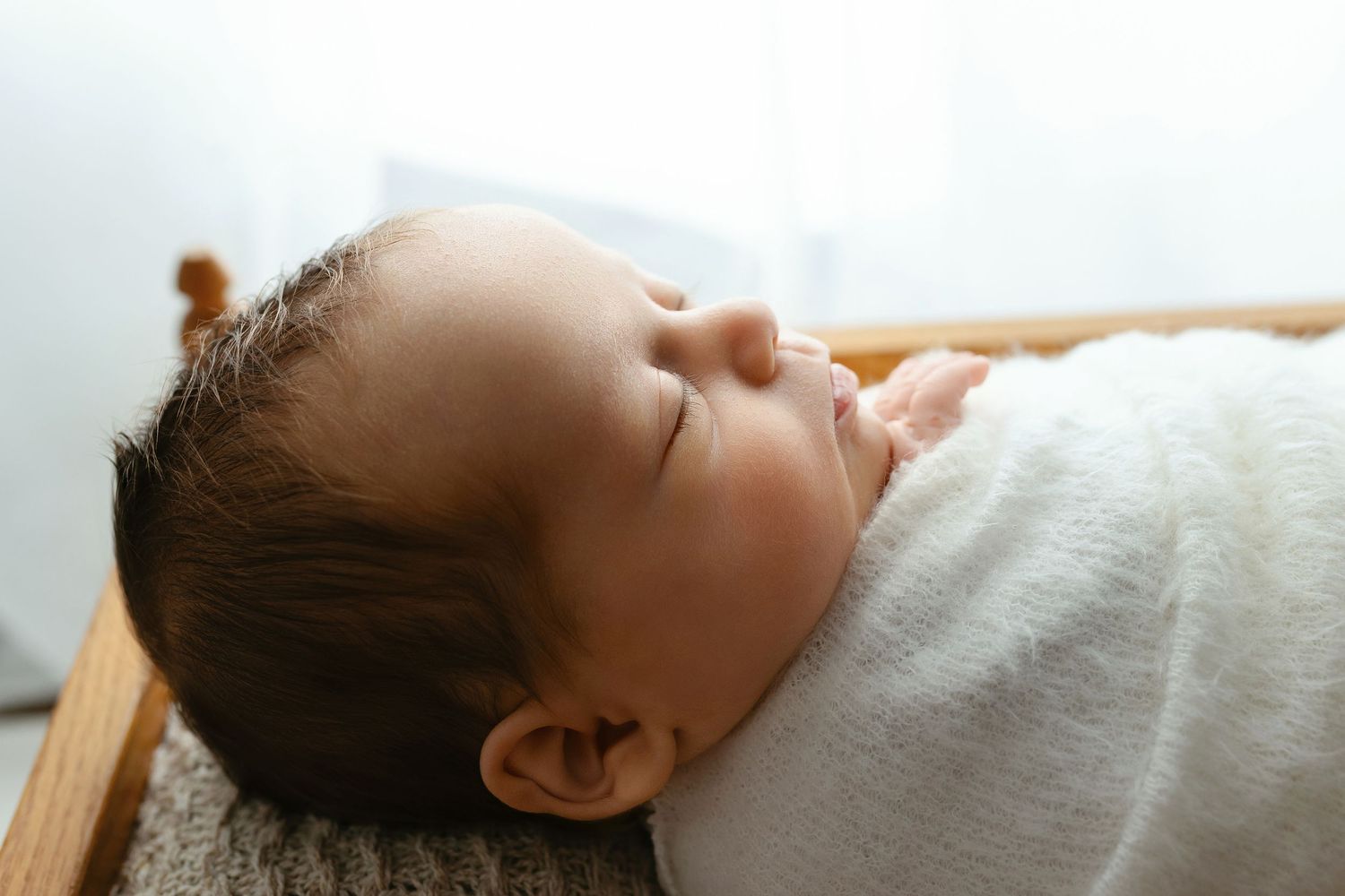Baby boy in a cradle. - Greenville, SC newborn photographer - Easley, SC newborn photographer.