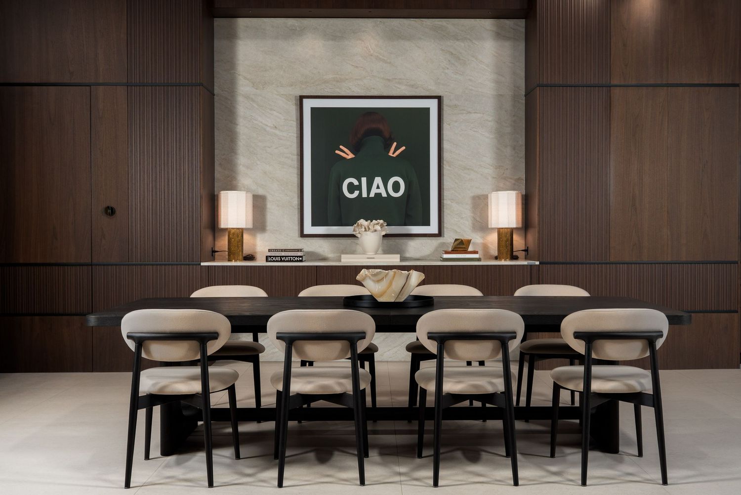 Modern restaurant interior with dark wood paneling, white chairs, and ambient lighting creating an elegant dining atmosphere.